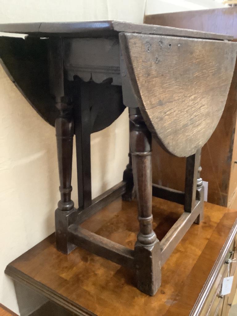 An early oak gateleg occasional table, width 60cm, depth 29cm, height 53cm